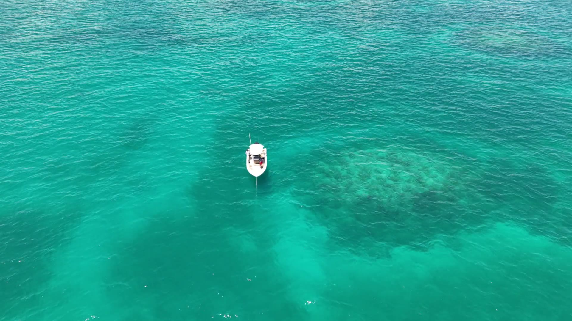 Turquoise water and reef from above, aerial still